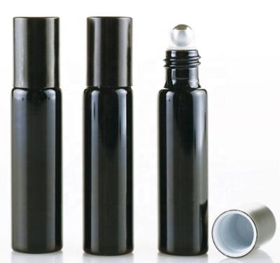 China Cosmetic matte black glass roll on bottle with stainless steel gold rollerball for essential oil 5ml 8ml 10ml 15ml for sale