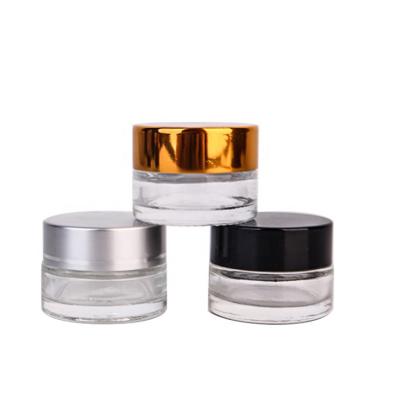 China Personal Care 30ml Fast Delivery Clear Cosmetic Cream Container Round Glass Jar With 1OZ Black Lid for sale