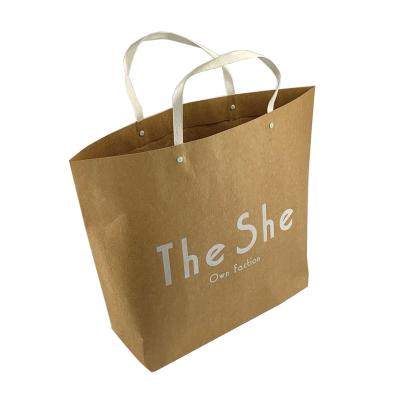 China Recyclable Custom Luxury Fashion Labeled Kraft Paper Bag With Handles for sale