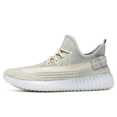 China JSYA2011-1 fashion trend Fly-weaving stylish sport walking woman shoes unique TPR ladies sneakers shoes jelly shoes for sale