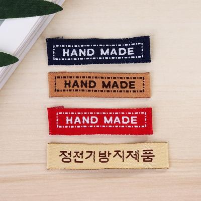 China Standard Stock Size Sustainable Cheap Double Page Woven Label For Clothing for sale