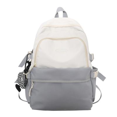 China Waterproof 2023 New Junior High School Students High Capacity Lightweight Backpack High Quality Simple and Versatile Shoulder Bag for sale