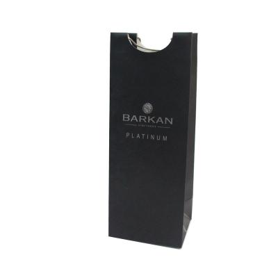 China Disposable Coated Paper Wine Bottle Black Paper Bag With Metal Handle Custom Design Available for sale