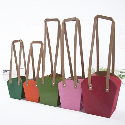 China Recyclable Waterproof Kraft Flower Bag Plant Potted Storage Handle Bag for sale