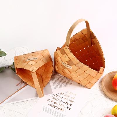 China Sustainable Natural Handmade Striped Fir Leaf Brown Wood Woven Storage Basket Wood Hand Basket for sale