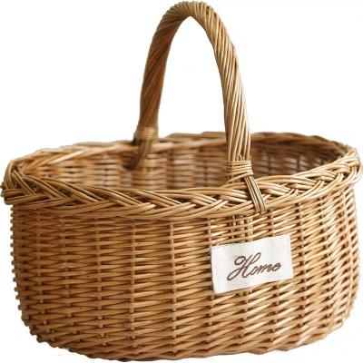 China Handwoven Spring Outlet Artifact Rattan Storage Basket Picnic Oval Gift Storage Basket Canvas Viable for sale