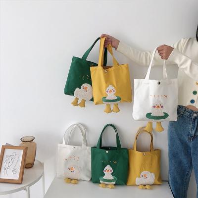 China Custom Designer Tote Bag For School Girl Canvas Bento Lunch Bags Cartoon Duck Shoulder Shopping Ladies High Quality for sale