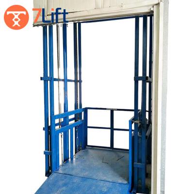 China Low Noise SevenLift Steel Guide Rail Motorized Guide Rail Warehouse Cargo Hydraulic Travel Vertical Loading Pallet Lift Vertical Platform Stationary for sale