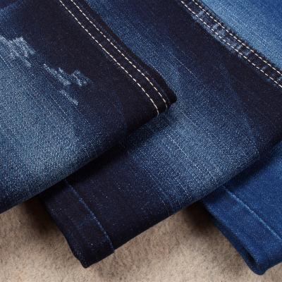 China new cotton 90%cotton jeans fabric T400 double core dye cord dualfx good recovery indigo color shade competitive high quality denim fabric for sale