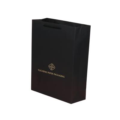 China Recycled Materials Custom Black Heavy Duty Large Shopping Paper Bag For Retail Merchandise Clothing Boutique for sale