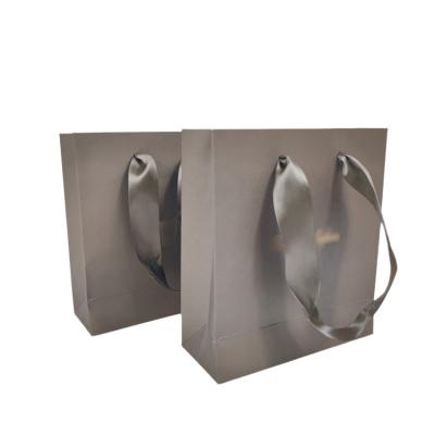 China Custom Recyclable Paper Bags Recyclable Paper Gift Bags With Handles For Shopping for sale