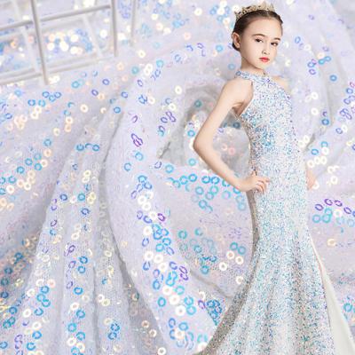 China Ready to ship Tear-resistant white gold sequin embroidery fabric 3mm sequin fabric wedding dress decoration colorful magic color for sale