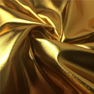 China Best Selling Metallic Foil Coating Fabric High Quality Polyester Colorful Elastic Fabric Shiny Gold Stamping Knitting Fabric for sale