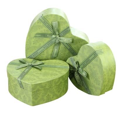 China Recycled Materials Custom Bowknot Luxury High End Heart Shaped Ribbon Valentine's Day Birthday Gift Recycled Cosmetic Paper Box for sale