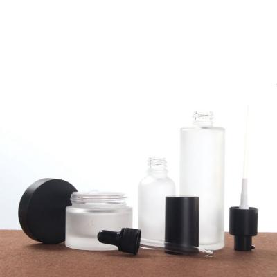 China Matte Polish Luxury Hot Selling Lotion Cream Bottle And Cream Glass Jar Skin Care Cosmetic Packaging Set for sale