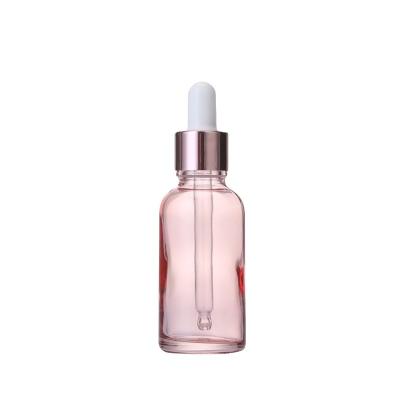 China China Cosmetic Supplier Custom Empty Romantic Pink Color Boston Round Essential Oil Glass Bottle for sale