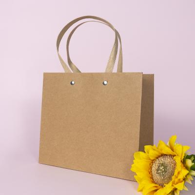 China Wholesale Luxury Recyclable Famous Brand Gift Black Paper Bags Recyclable Shopping Paper Bag With Handles for sale