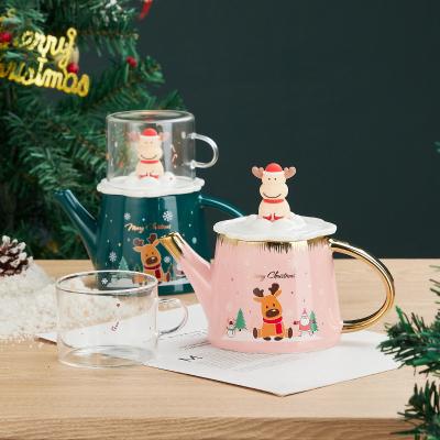 China Sustainable Fashionable 2pcs Christmas Themed Teapot And Cup Set Little Snowman And Santa Christmas Cup With Glass Mug for sale