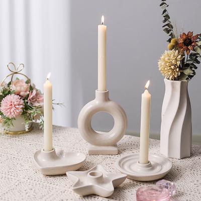 China Modern Unique Art Wholesales Ceramic Burning Ornament Nordic Candle Holder Candlestick Display Wedding Party Candlestick Holder for sale