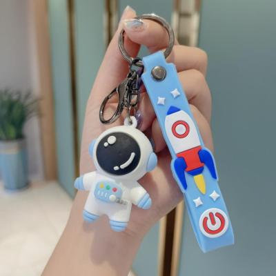 China Fashion Epoxy Astronaut Doll Bag Fashion Accessories Car Part Rubber Key Chains Eco Friendly Cartoon Pendant for sale