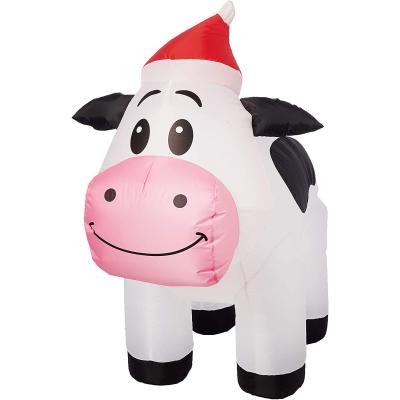 China Promotion Sign Group Spotted Inflatable Cow With Santa Hat for sale