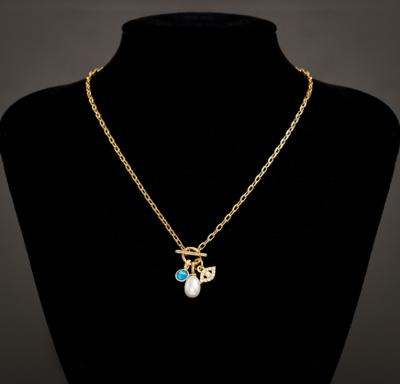 China 18K Gold 18K Gold Evi Necklace Evi Eye CZ Chain Blue Stone Charm Necklace CLASSIC Baroque Bead Necklace for sale