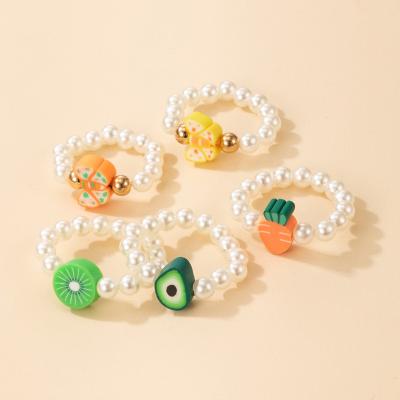 China Korean Cute Crystal Flower Elastlc Ring Fruit String Beads Candy Color Ring For Girl for sale