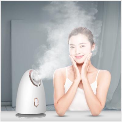 China Protable New Nano Ionic Facial Warm Mist Facial Sauna Humidifier Home Sauna Face Steamer Beauty Instrument for sale