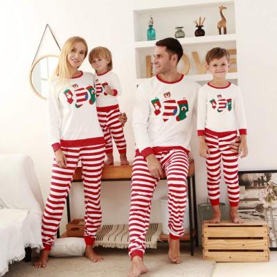 China 2021 QUICK DRY Christmas Pajamas Stocking Printing Mommy And Me Red Stripe Family Matching Outfits Pajamas For Christmas for sale