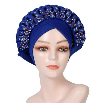 China Latest African Woven Turban Women's Turban Multifunctional Luxury Hat Nigerian Rhinestone Turban African Woven Hot Selling for sale