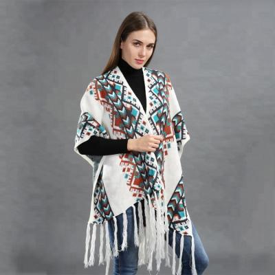 China Latest Design Women Winter Acrylic Wholesale Shawl With Fringe Fashion Poncho Cover Wraps for sale