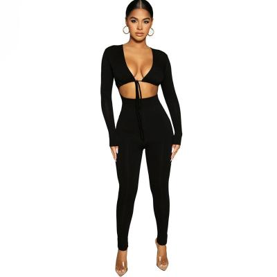 China New Trend V-Neck Solid Color Rib Fabric Long Sleeve Hollow Out Lace Up Jumpsuits Female Sexy Navel Deep QUICK DRY Jumpsuit for sale