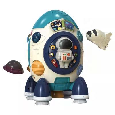 China Battery Operated Multi Functional Baby Rocket Story Machine Music and Light Projector Plastic Baby Learning Toys for sale