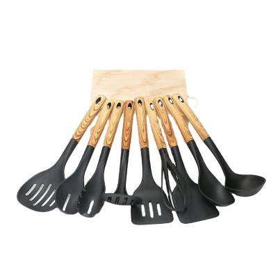 China 9 Pieces Multifunctional Non-Stick Safe Nylon Material Tool Kit Sustainable Kitchen Shovel With Wooden Pattern Handle for sale