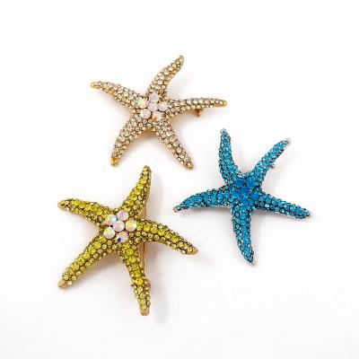 China Economical Flower Ladies Alloy Rhinestone Brooches Pin In Star Shape for sale