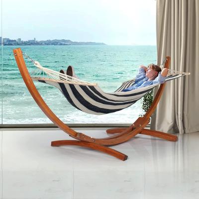 China Comfortable Arc Hammock Stand And Cotton Fabric Spreader Bar Hammock With Wooden Stand for sale