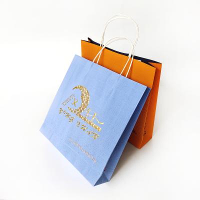 China Hot Sale Disposable Gold Stamping Packaging Custom Logo Paper Bag With Paper Handle for sale