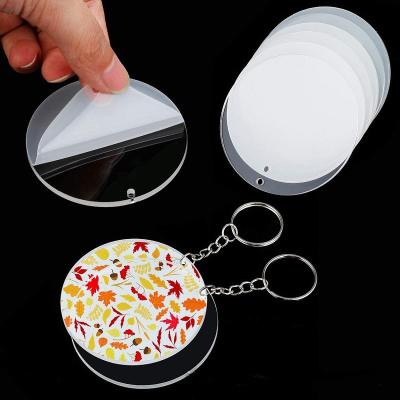 China Cheap Custom DIY Shape Clear Double Sided Acrylic Circle Mute Key Chain For DIY Christmas Key Chain for sale