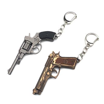 China High Quality Decorational Metal Fire Mini Pistol Key Ring Popular Cool Cross Gun Metal Key Chain For Bag for sale