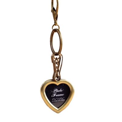 China Hotsale popular retro design metal heart key chain photo frame keychains pendant for sale