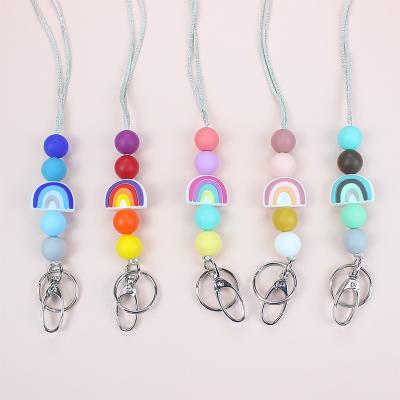 China 2022 New Design Silicone Bead Rainbow Macrame Key Chain Eco-Friendly Wooden Lanyard Teacher Id Badge Holder Boho Key Chain Mom Gifts for sale