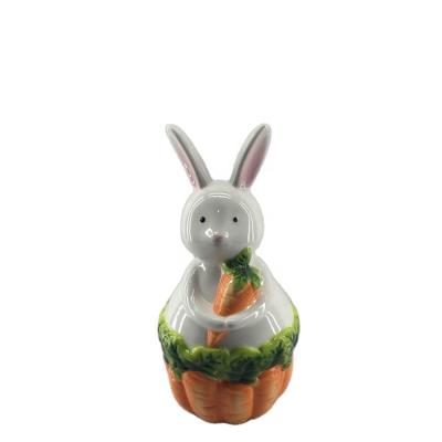 China CLASSIC cute cartoon ceramic stonerware craft rabbit with carrot base for desk decoration for sale