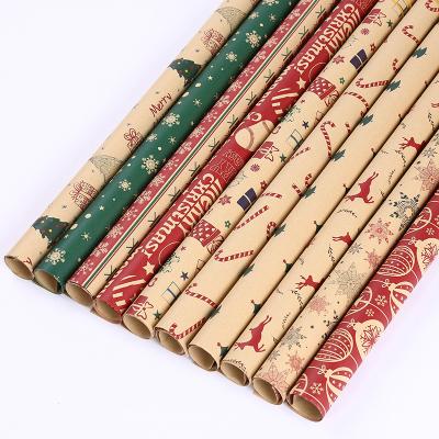 China Eco-friendly Creative Decorative Paper Santa Snowman Snowflake Printed Brown Kraft Christmas Wrapping Paper Gift Box Packaging Paper for sale