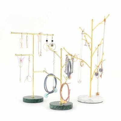 China Tree Shape Gold Metal Window Bar Daily Life Retail Shop T Jewelry Marble Stone Display Stand for sale