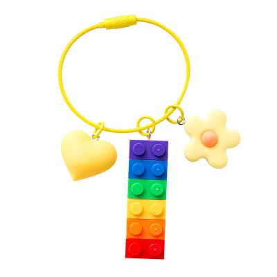 China Wholesale Alloy+plastic Building Block Rainbow Bell Pink Pendant Bag Cute Car Decoration Rubber + Key Chain for sale