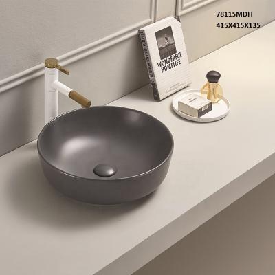 China Eco-Friendly Small Bathroom Basin Vanity Top Around Matt Ceramic Basin for sale