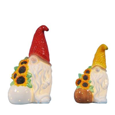 China Ceramic Funny Gnome Little Gnome Figurine Small Gnome Figurine Easter Wholesale Gnomes With Flowers For Home Decoration for sale