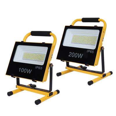 China Multifunctional ABS USB Camping Music 100w Charging Home Emergency Led Solar Flood Lights for sale