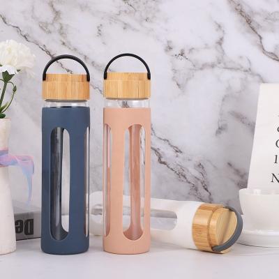 China Hot Selling New Viable Hot Portable Water Cup Customization Silicone Wrap Glass Water Bottle With Bamboo Lid for sale