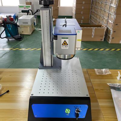 China 50kw Drink Bottle Time Marking Flags Makers Mark Perfumes UV Laser Marking Machine for sale